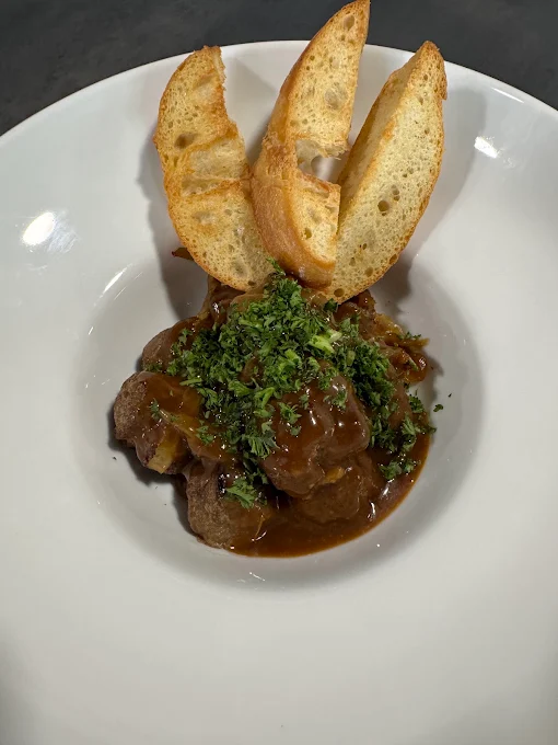 Signature peppersteak meatballs with crostini
