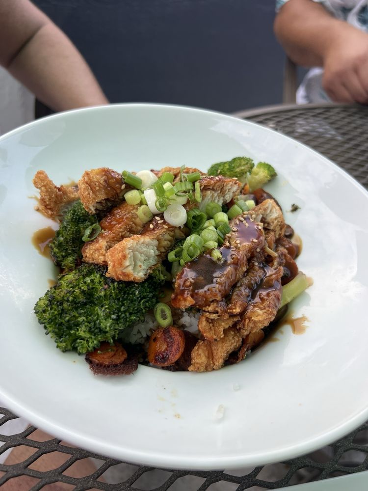 Crispy sesame chicken rice bowl with broccoli